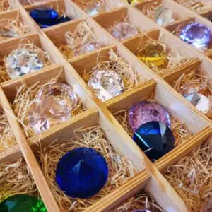 colorful gemstone lot in wooden box